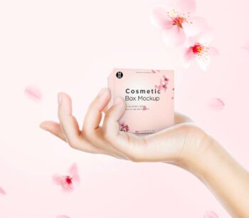 Hand holding the cosmetic box packaging mockup