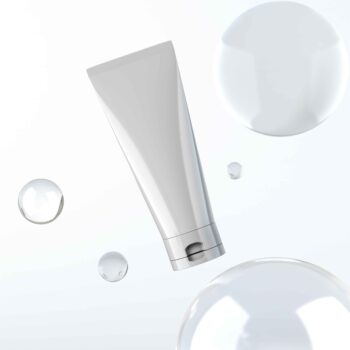 Cosmetic cream tube mockup with blue background and bubbles
